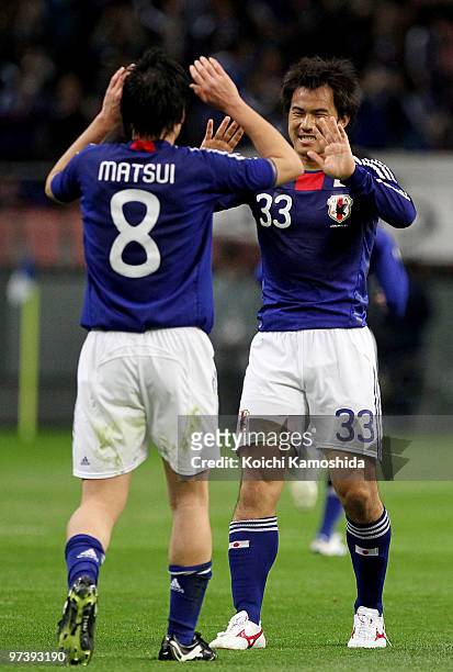 Shinji Okazaki of Japan celebrates with Daisuke Matsui after scoring his team's first goal during the AFC Asian Cup Qatar 2011 Group A qualifier...