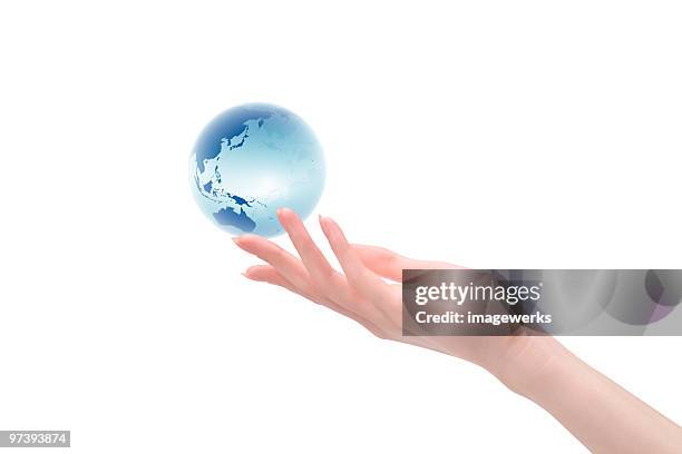 woman holding globe against white background - 2000 world series stock pictures, royalty-free photos & images