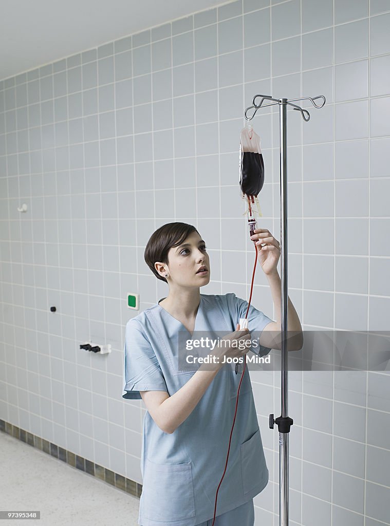 Nurse preparing blood bag