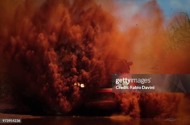 car covered with dirt at cross country race, barretos, sao paulo state, brazil - rally car racing stock-fotos und bilder