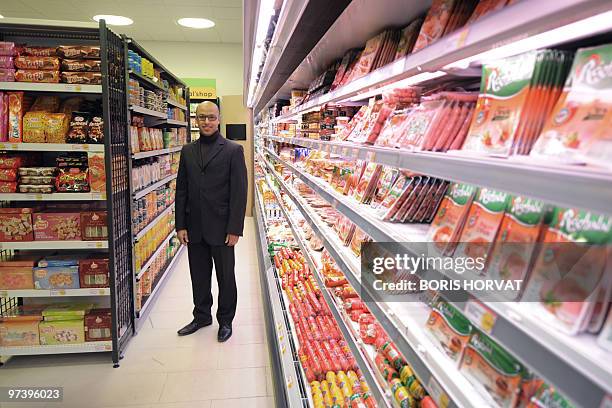 Moroccan-born French 30-year-old, Rachid Bakhalq, poses at "Hal' shop", his supermarket selling halal food, in Nanterre, a Paris suburb, inaugurated...