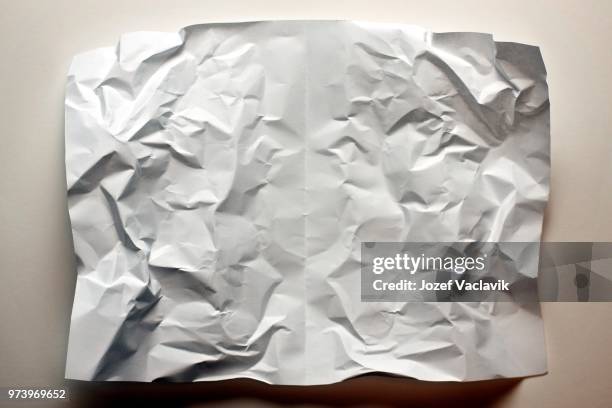 piece of blank crumpled paper - crumpled paper stockfoto's en -beelden