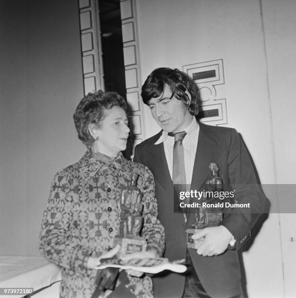 English actors Peggy Ashcroft and Alan Bates pictured with their Best Actress and Best Actor awards at the 1971 Evening Standard Theatre Awards in...