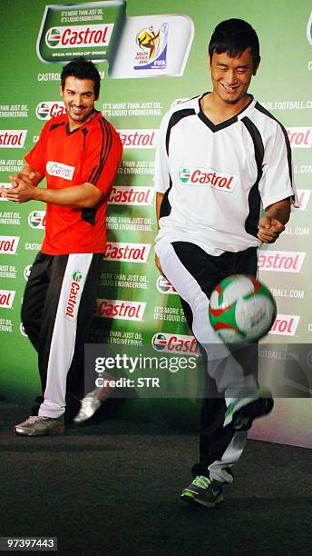 Indian footballer Baichung Bhutia and Bollywood actor John Abraham in their roles as Castrol Brand Ambassadors attend a Castrol pre-2010 FIFA world...