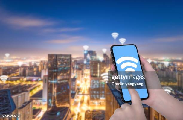 smart phone and wireless communication - gripping phone stock pictures, royalty-free photos & images