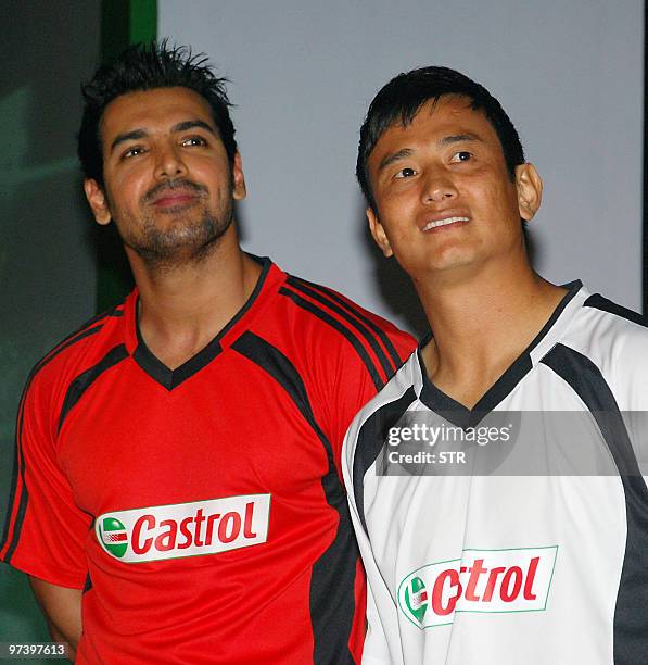 Indian footballer Baichung Bhutia and Bollywood actor John Abraham in their roles as Castrol Brand Ambassadors attend a Castrol pre-2010 FIFA world...