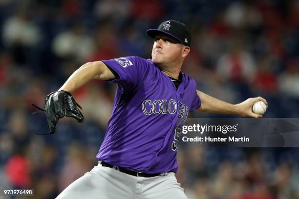 Jake McGee of the Colorado Rockies delivers a pitch in the eighth inning during a game against the Philadelphia Phillies at Citizens Bank Park on...