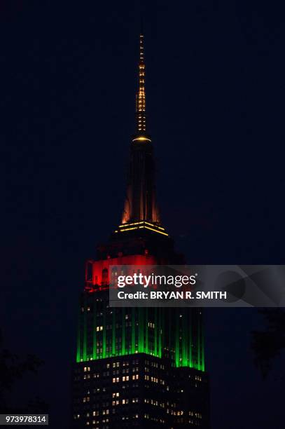 Portugal is represented as the Empire State Building celebrates the 2018 World Cup by illuminating its tower lights in a rotation of colors with each...