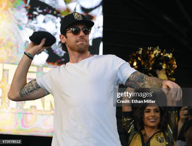 James Neal of the Vegas Golden Knights throws T-shirts to the crowd as he is introduced at the team's "Stick Salute to Vegas and Our Fans" event at...