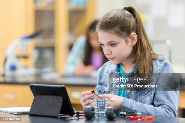 high school student uses digital tablet - matrix organisation stock pictures, royalty-free photos & images