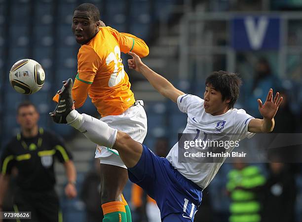 Lee Keun-Ho of Korea contests with Souleman Bamba of Ivory Coast during the International Friendly match between Ivory Coast and Republic of Korea...