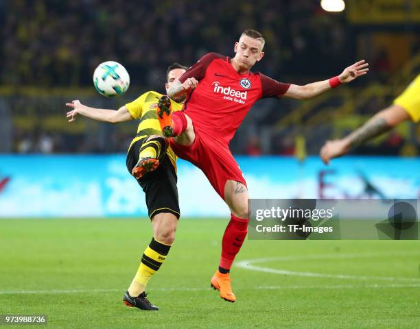 Gonzalo Castro of Dortmund and Marius Wolf of Frankfurt battle for the ball during the Bundesliga match between Borussia Dortmund and Eintracht...