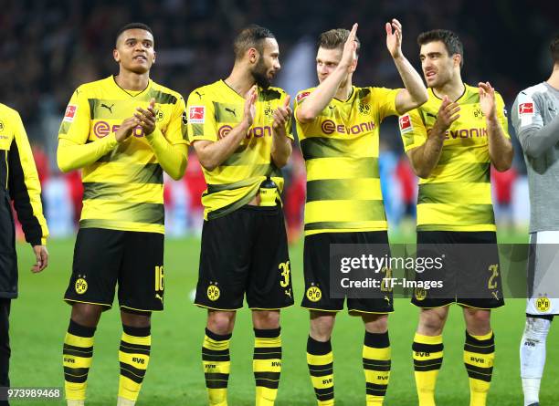 Manuel Akanji of Dortmund, Oemer Toprak of Dortmund, Lukasz Piszczek of Dortmund and Sokratis Papastathopoulos of Dortmund celebrate after winning...