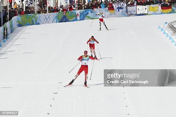 Winter Olympics: USA Bill Demong , USA Johnny Spillane and Austria Bernhard Gruber in action during Men's Individual 10K Cross Country Final at...