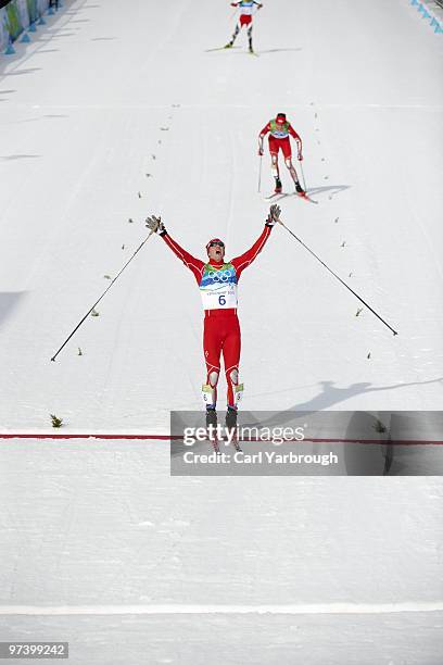 Winter Olympics: USA Bill Demong victorious after winning Men's Individual LH/ 10K CC Final vs USA Johnny Spillane and Austria Bernhard Gruber at...