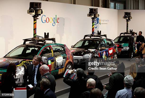 Visitors gather in front of German Google Street View cars at the Google stand at the CeBIT Technology Fair on March 3, 2010 in Hannover, Germany....