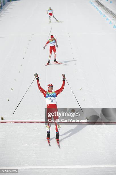 Winter Olympics: USA Bill Demong victorious after winning Men's Individual LH/ 10K CC Final vs USA Johnny Spillane and Austria Bernhard Gruber at...