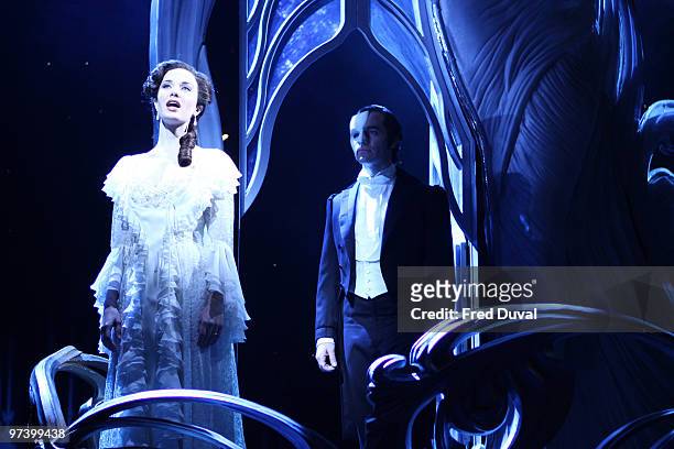 Sierra Boggess and Ramin Karimloo perform onstage during the photocall for 'Love Never Dies' at The Adelphi Theatre on March 3, 2010 in London,...