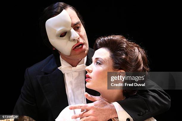 Ramin Karimloo and Sierra Boggess perform onstage during the photocall for 'Love Never Dies' at The Adelphi Theatre on March 3, 2010 in London,...