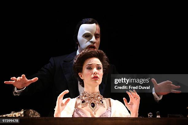 Sierra Boggess and Ramin Karimloo perform onstage during the photocall for 'Love Never Dies' at The Adelphi Theatre on March 3, 2010 in London,...