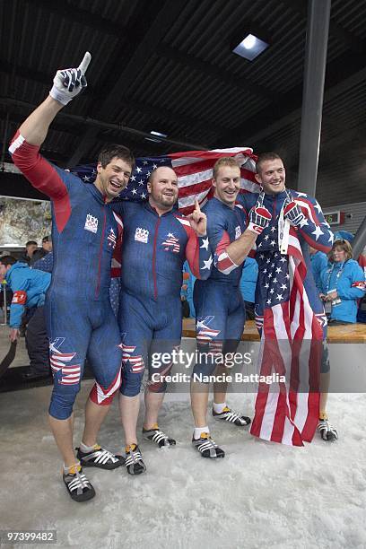 Winter Olympics: Team USA 1 Steve Mesler, Steven Holcomb, Curtis Tomasevicz, and Justin Olsen victorious after winning Men's Bobsled Four Man Final...