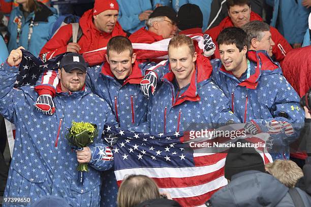 Winter Olympics: Team USA 1 Steven Holcomb, Justin Olsen, Curtis Tomasevicz, and Steve Mesler victorious after winning Men's Bobsled Four Man Final...