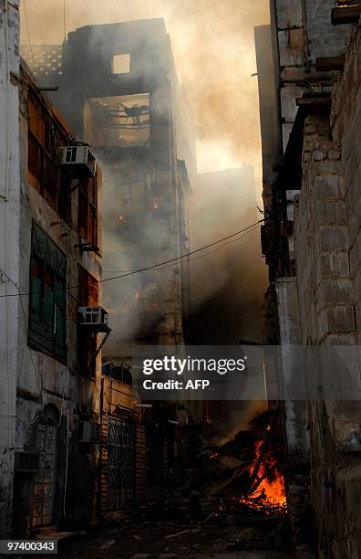 Fires rage in old buildings in the historic quarter of the Saudi Red Sea port city of Jeddah on March 3, 2010. Ten firebrigade teams were in the...