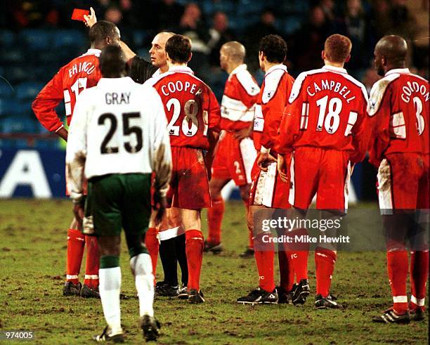 Ugo Ehiogu of Middlesbrough is shown the red card by referee Mike Dean during the AXA sponsored FA Cup fourth round replay match between Wimbledon...