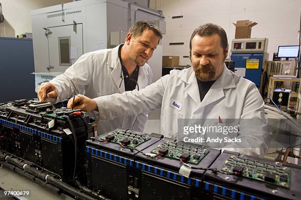 technicians at work in auto battery lab - car battery stock pictures, royalty-free photos & images