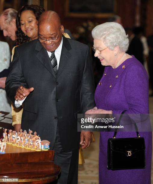 Queen Elizabeth ll shows South African President Jacob Zuma and wife Thobeka Madiba Zuma an exhibition of South African items from the Royal...