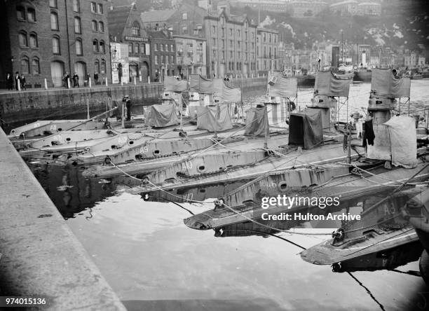 The Royal Navy's first British-designed submarines the A-class submarines of HM A8, A6, A10, A9, A12, A5, A11 and A7 moored together in Dover harbour...