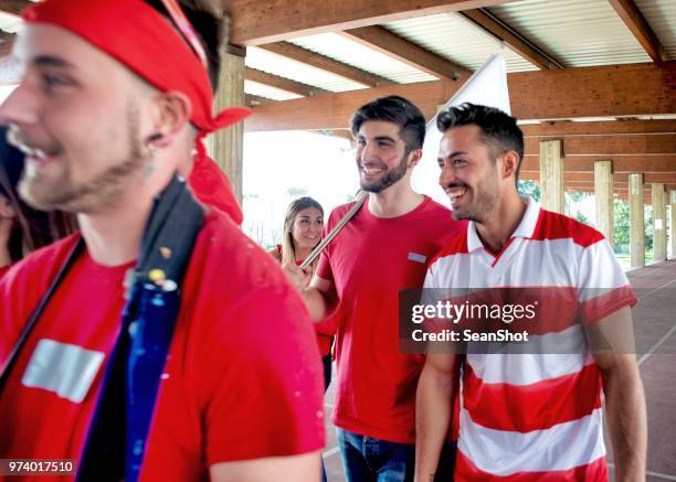 group of supporters going to stadium - stadium entrance stock pictures, royalty-free photos & images