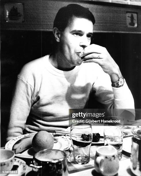 John McLaughlin from the Mahavishnu Orchestra eats a meal in Amsterdam, Netherlands in 1974