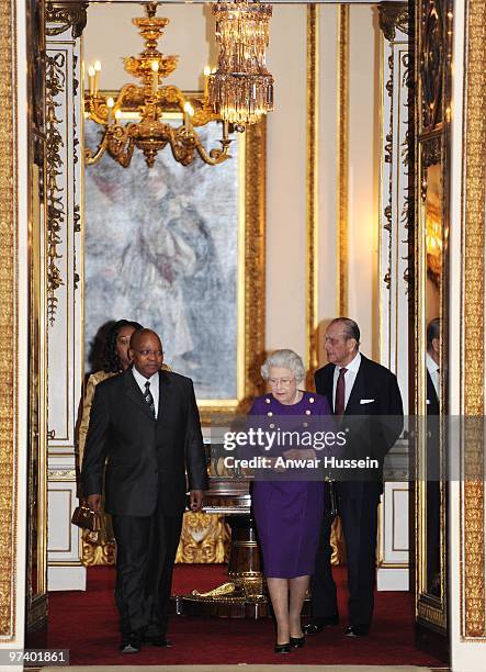 Queen Elizabeth ll and Prince Philip, Duke of Edinburgh show South African President Jacob Zuma and wife Thobeka Madiba Zuma an exhibition of South...