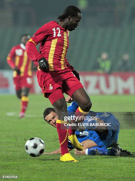 Sejad Salihovic of Bosnia and Herzegovina and Prince Tagoe of Ghana vie for the balll during their friendly soccer match held in Sarajevo, on March...