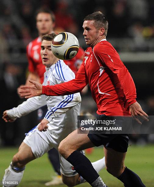 Kjetil Waehler of Norway and Slovakia's Erik Jendrisek fight for a ball during a friendly match between Slovakia and Norway in Zilina on March 3,...