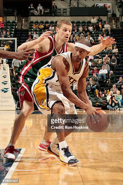 Ford of the Indiana Pacers handles the ball against Luke Ridnour of the Milwaukee Bucks during the game on February 25, 2010 at Conseco Fieldhouse in...