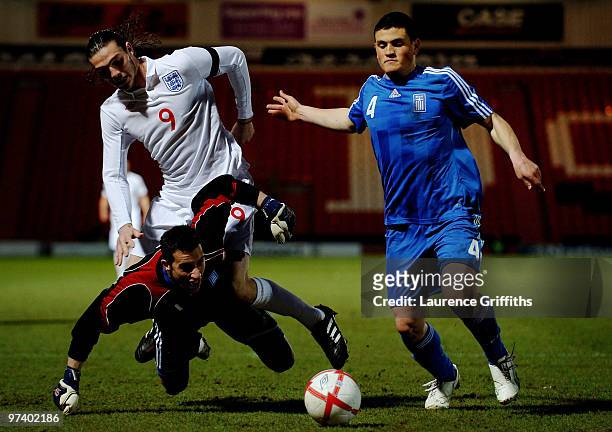 Andy Carroll of England battles for the ball with Asterios Giakoumis and Kyriakos Papadopoulos of Greece during the UEFA Under 21 Championship...