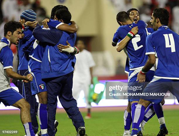 Kuwaiti's team celebrates at the end of their 2011 AFC Asian Cup group B qualifying football match against Oman in Muscat on March 3, 2010. The match...