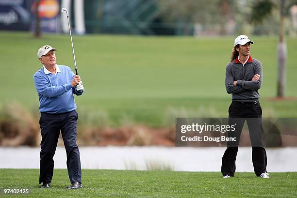 Tour legend Jack Nicklaus and his playing partner and Grammy winning musician, Kenny G follow Nicklaus' approach shot out of the rough on the first...