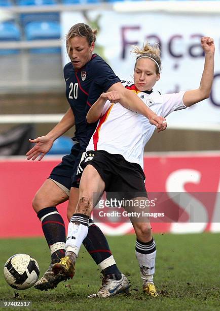 Barbett Peter of Germany and Abby Wambach of USA battle for the ball during the Women Algarve Cup match between Germany and USA on March 3, 2010 in...