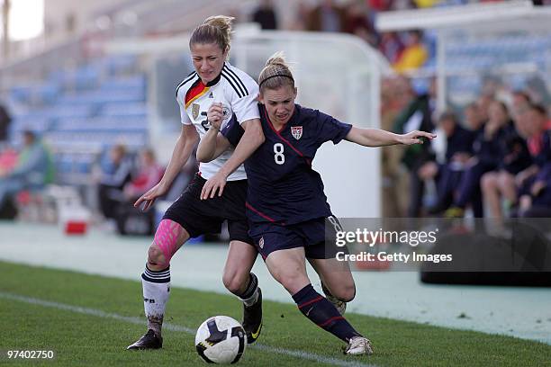 Bianca Schmidt of Germany and Amy Rodriguez of USA battle for the ball during the Women Algarve Cup match between Germany and USA on March 3, 2010 in...