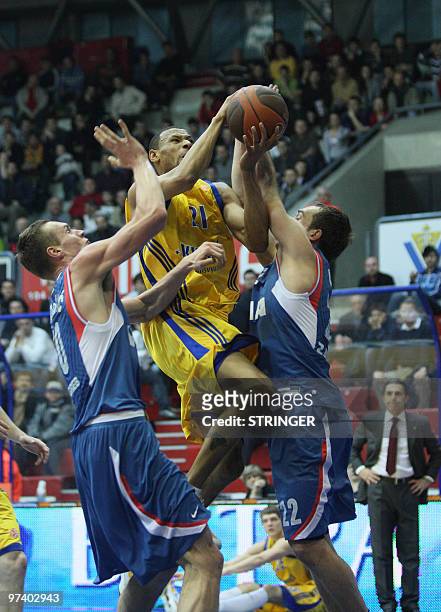 Khimki's McCARTY Kelly vies with Cibona's Udrih Marko and Leon Radosevic during their Euroleague basketball Khimki vs Cibona match in Zagreb, Croatia...