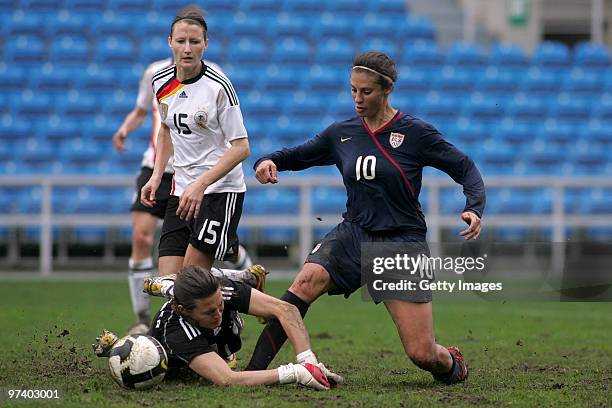 Nadine Angerer of Germany and Carli LLoyd of USA battle for the ball during the Women Algarve Cup match between Germany and USA on March 3, 2010 in...