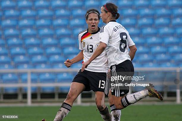 Celia Mbabi and Inka Grings of Germany celebrate during the Women Algarve Cup match between Germany and USA on March 3, 2010 in Faro, Portugal....