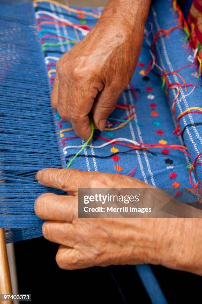 hands weaving with loom - mexican textile stock pictures, royalty-free photos & images