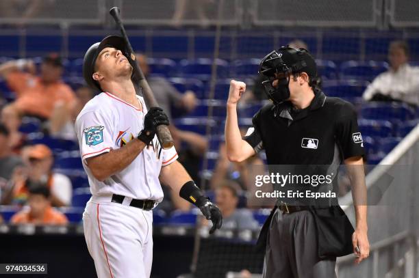 Realmuto of the Miami Marlins looks up towards the sky after striking out in the eighth inning against the San Francisco Giants at Marlins Park on...