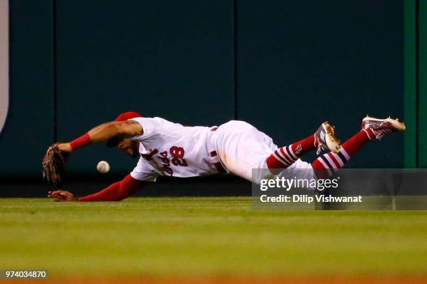 Tommy Pham of the St. Louis Cardinals fails to catch a line drive against the San Diego Padres in the sixth inning at Busch Stadium on June 13, 2018...