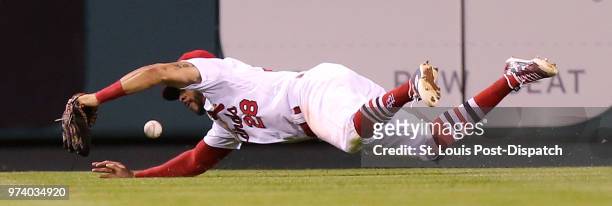 St. Louis Cardinals center fielder Tommy Pham is unable to catch a double by the San Diego Padres' Franmil Reyes in the sixth inning at Busch Stadium...