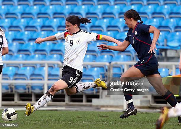 Birgit Prinz of Germany and Shanon Boxx of USA battle for the ball during the Women Algarve Cup match between Germany and USA on March 3, 2010 in...